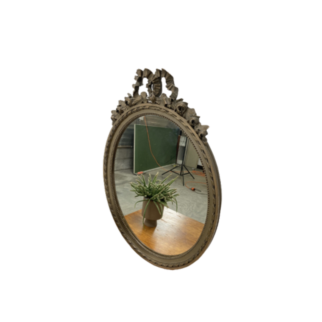 Vintage wooden mirror with arch and flowers