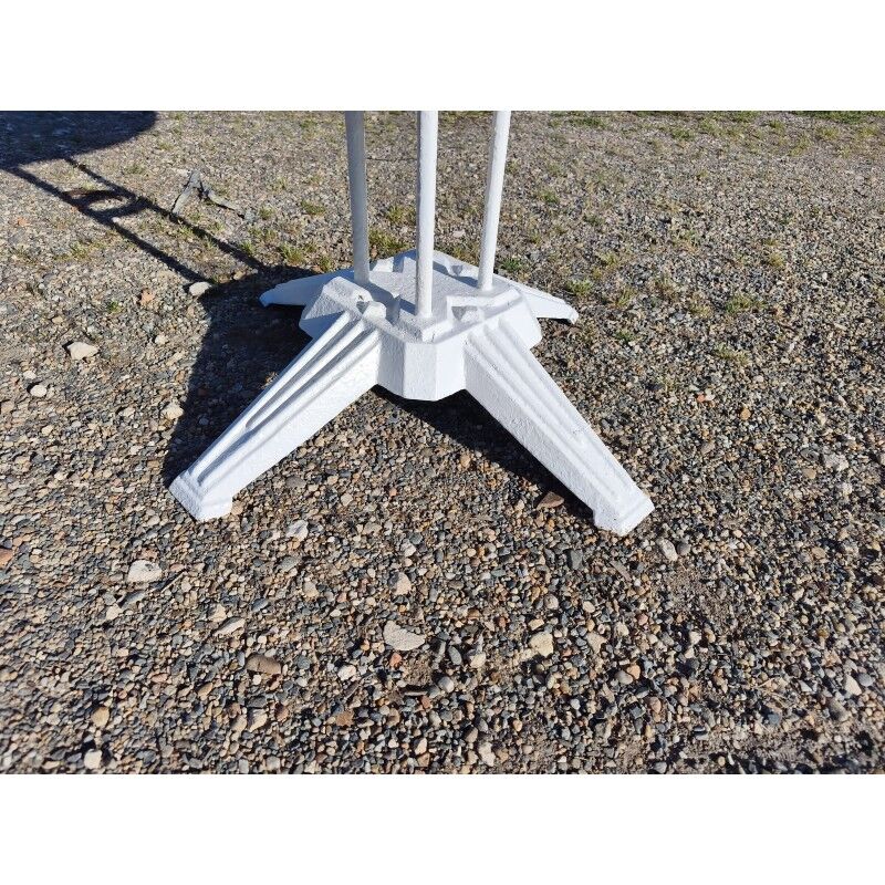Garden table with a cast iron base and a metal top.
