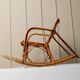 Vintage bamboo rocking chair for children - warm honey-brown cane with rattan frame, Boho mid-century Italian design (1970s)