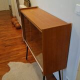 Small window on high metal feet