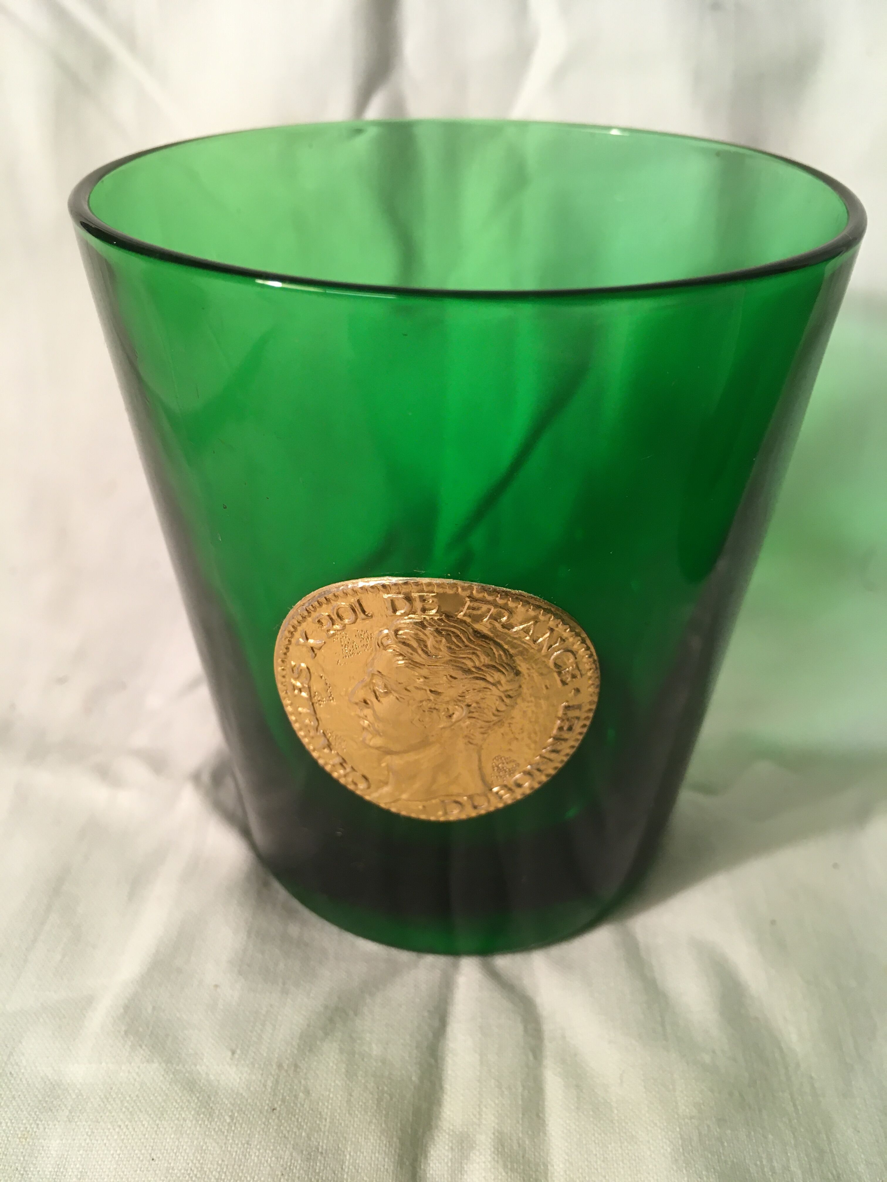 3 green glasses with silver gold shields