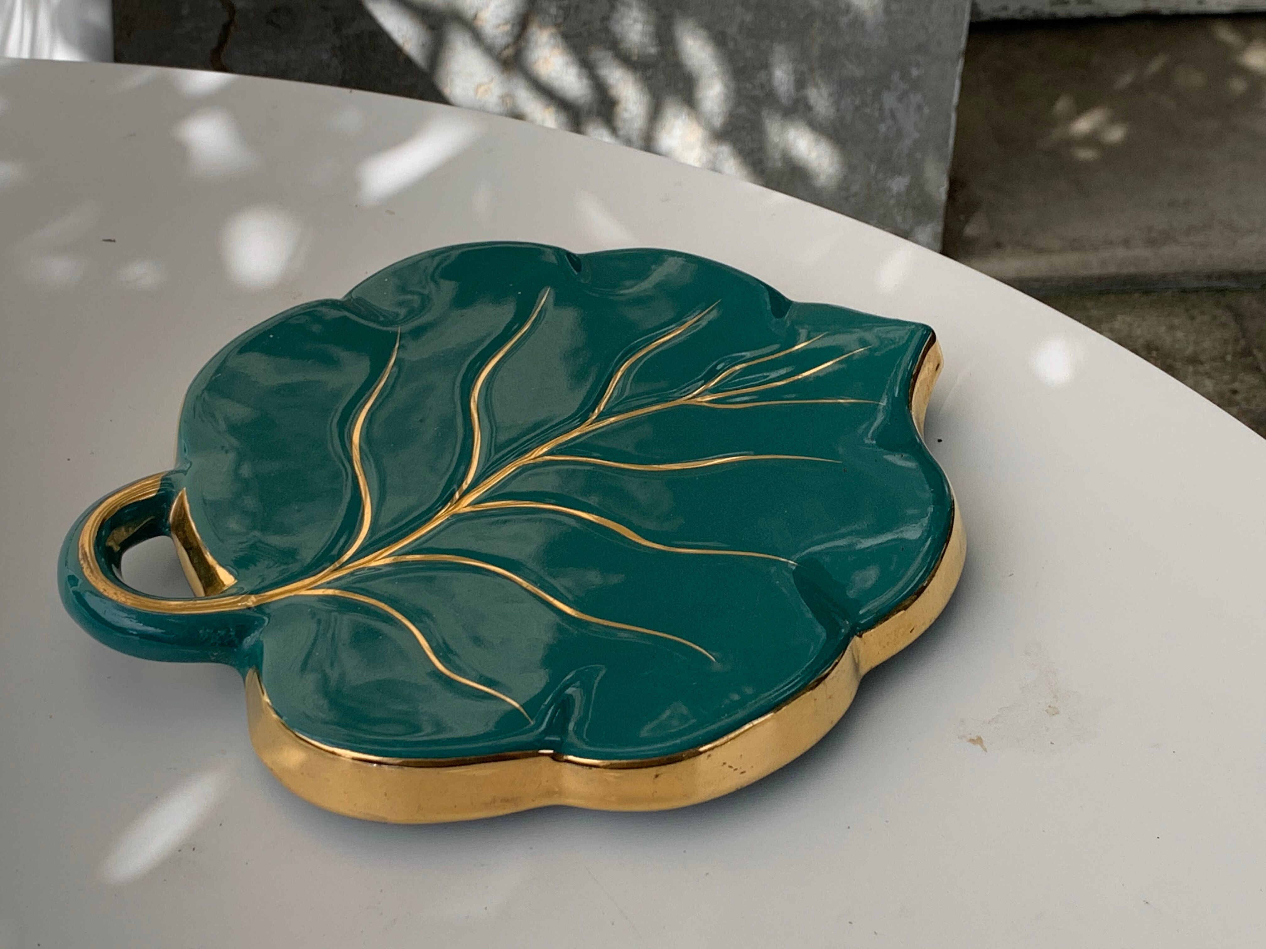 Grained in the shape of vintage dark green enamelled ceramic sheet