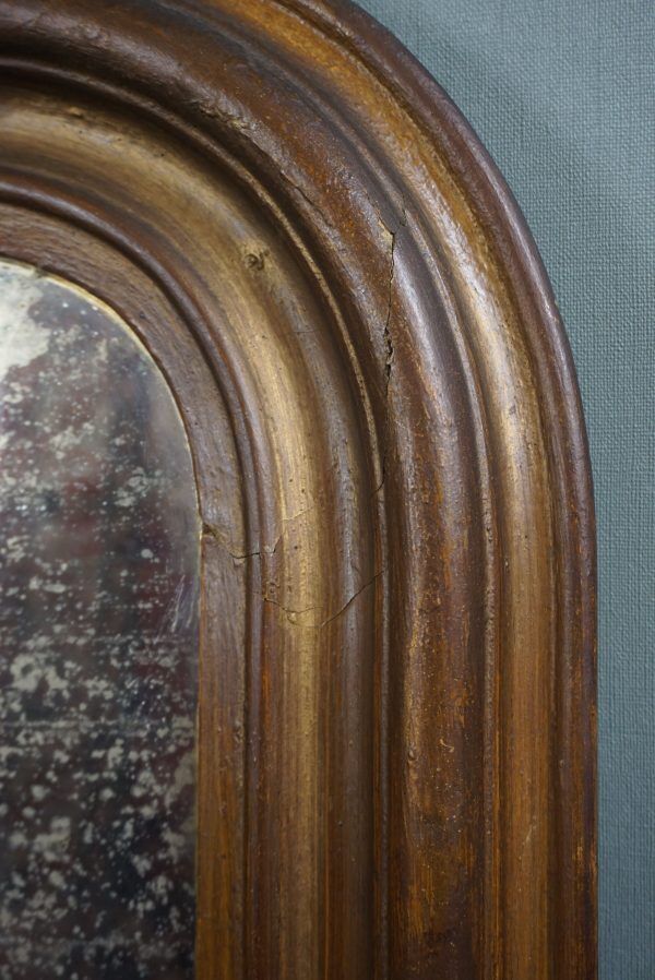 Old French fireplace mirror with beautiful ornament