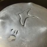 polished aluminum pocket emptier, signed and stamped in the mass