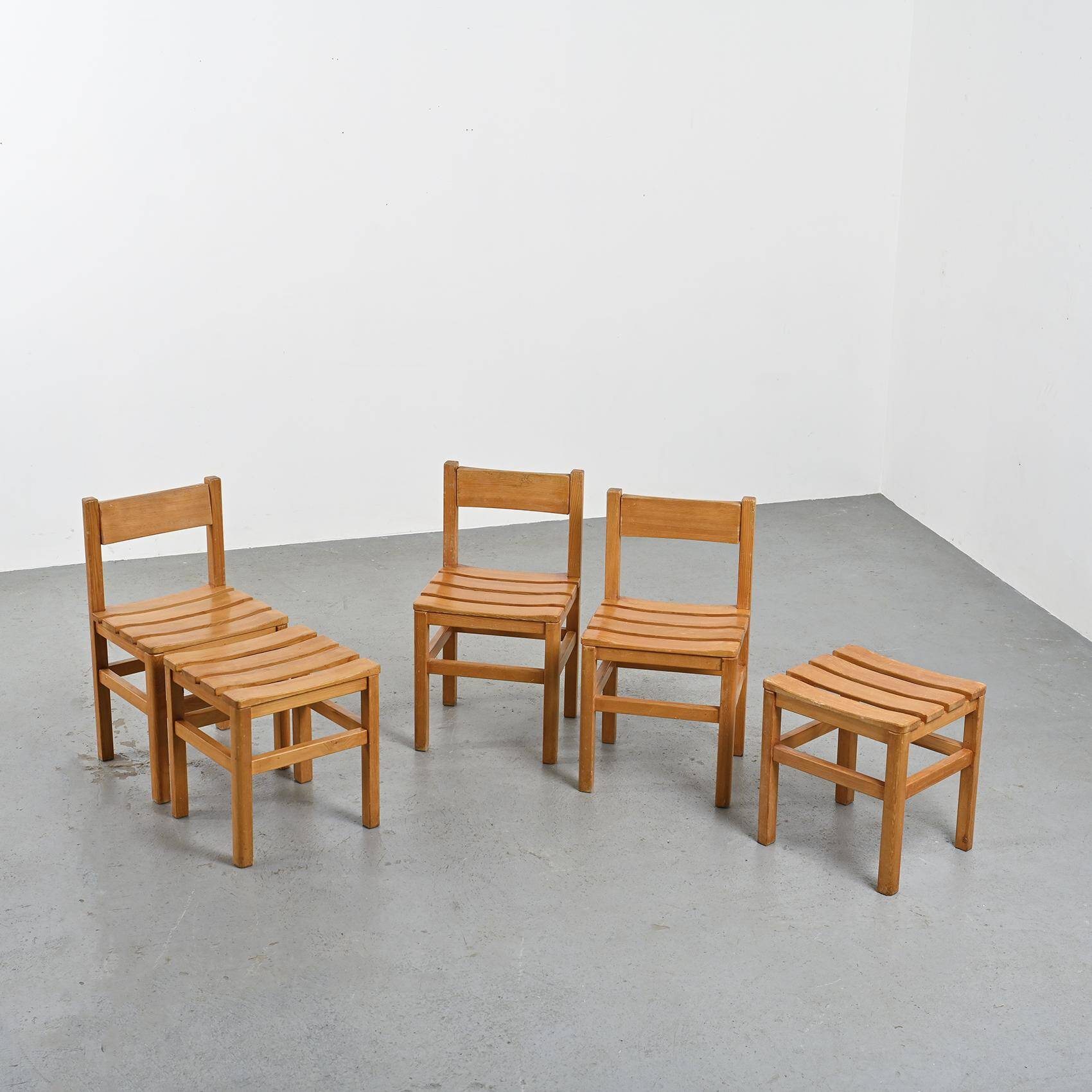 Set of three chairs and two stools Maison Regain, circa 1970