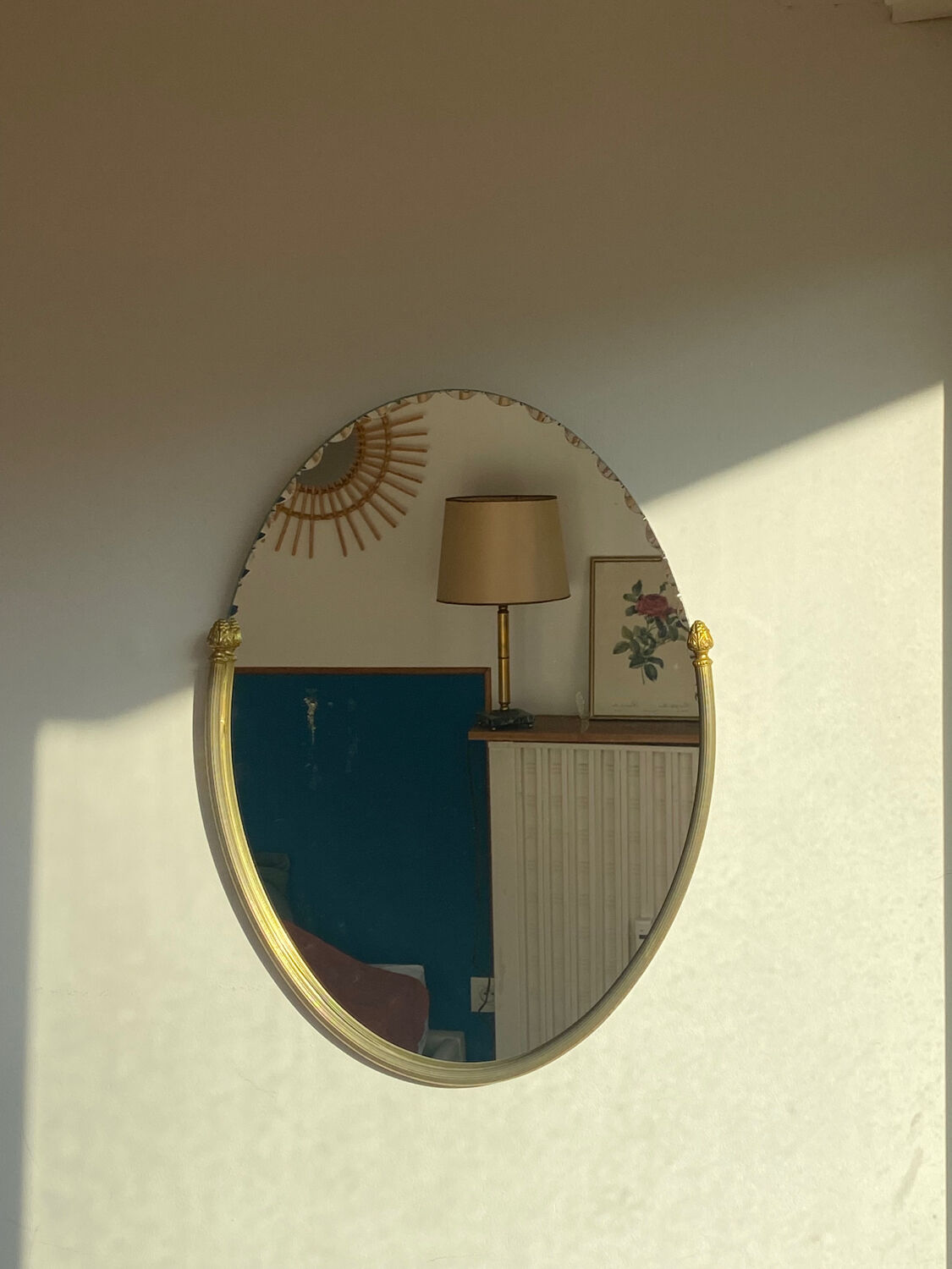 Beveled wall mirror with gold frame