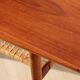 Vintage Scandinavian coffee table in teak and rattan – Danish design from the 1960s.