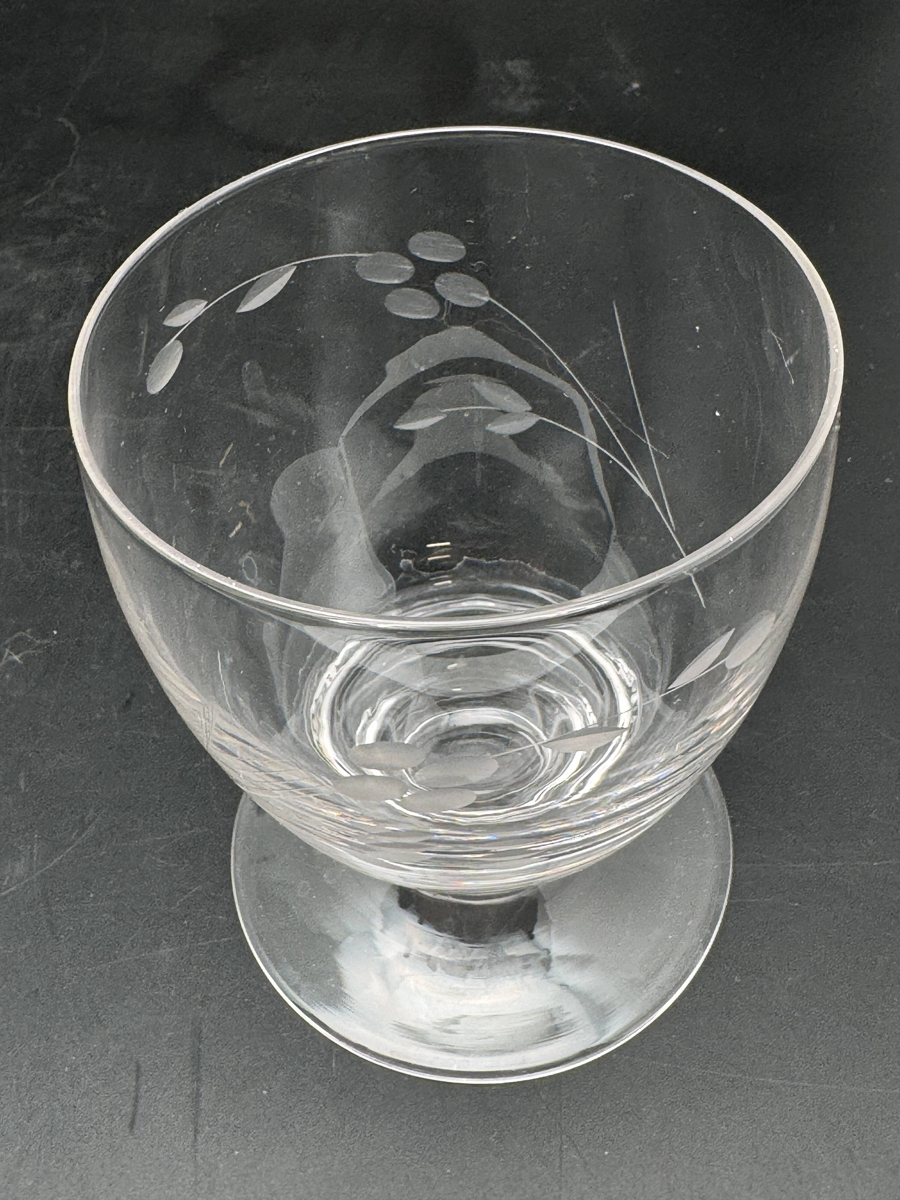 Set of fine glass stemmed glasses with small flower patterns