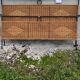 Black metal and rattan bed frame