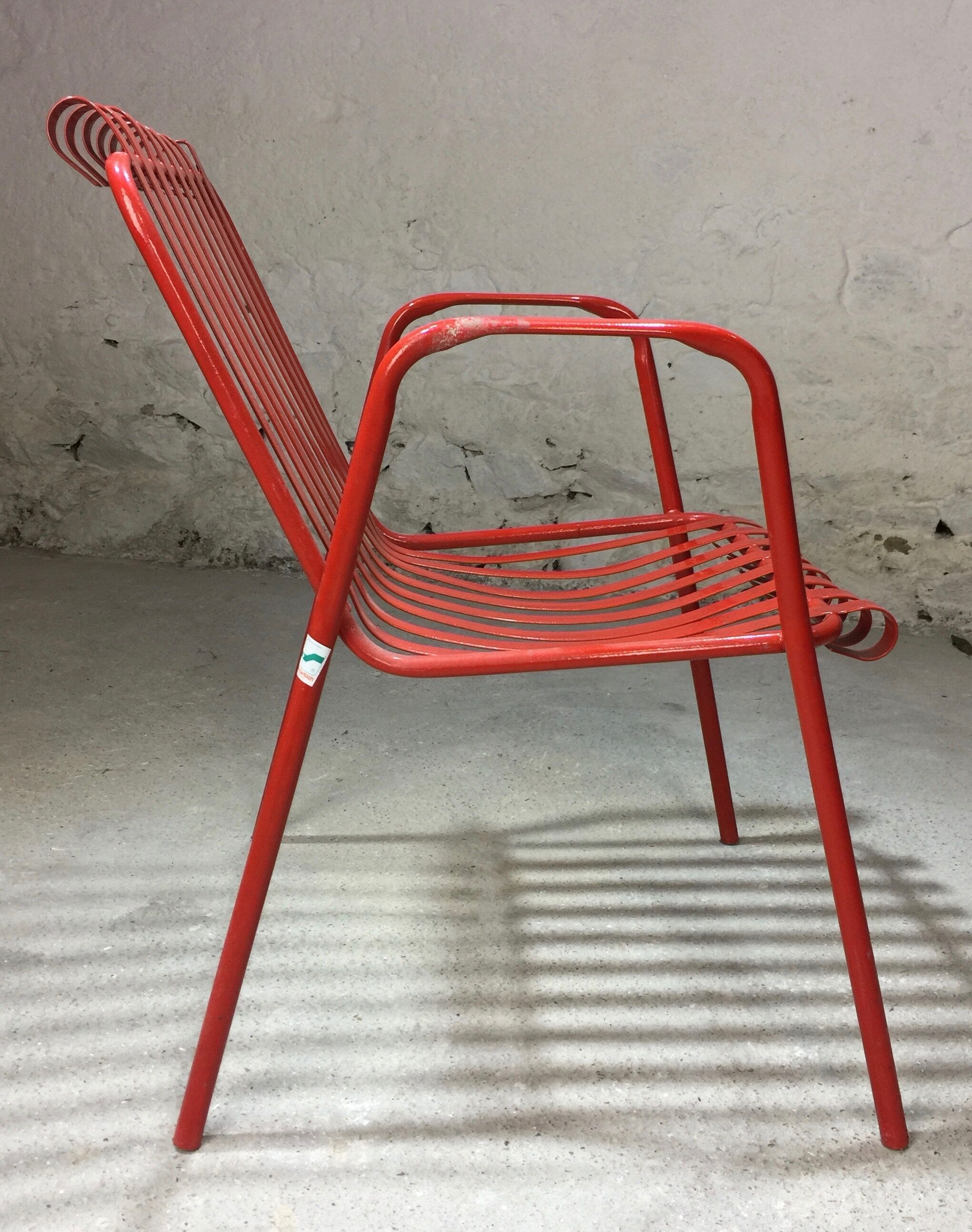 1960s red metal chair published by Stil Garden