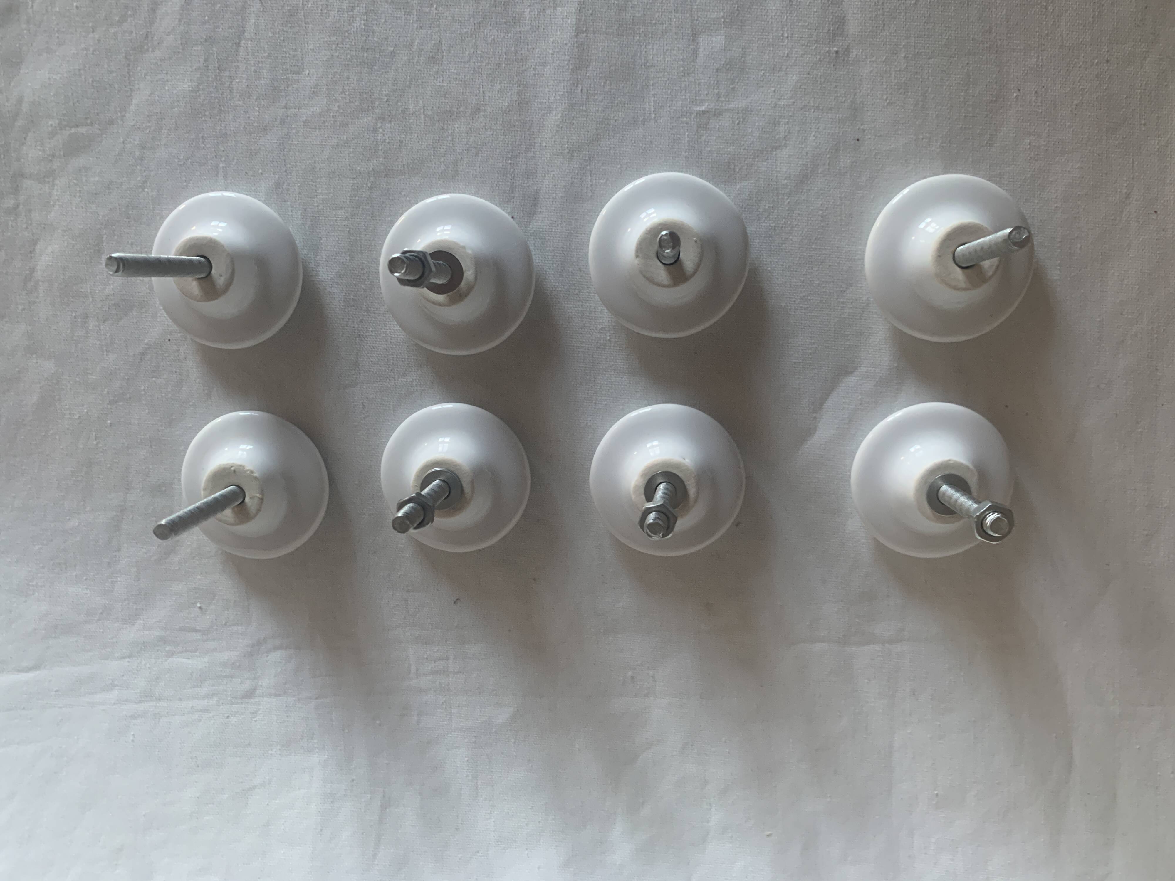 white ceramic door knobs with illustration