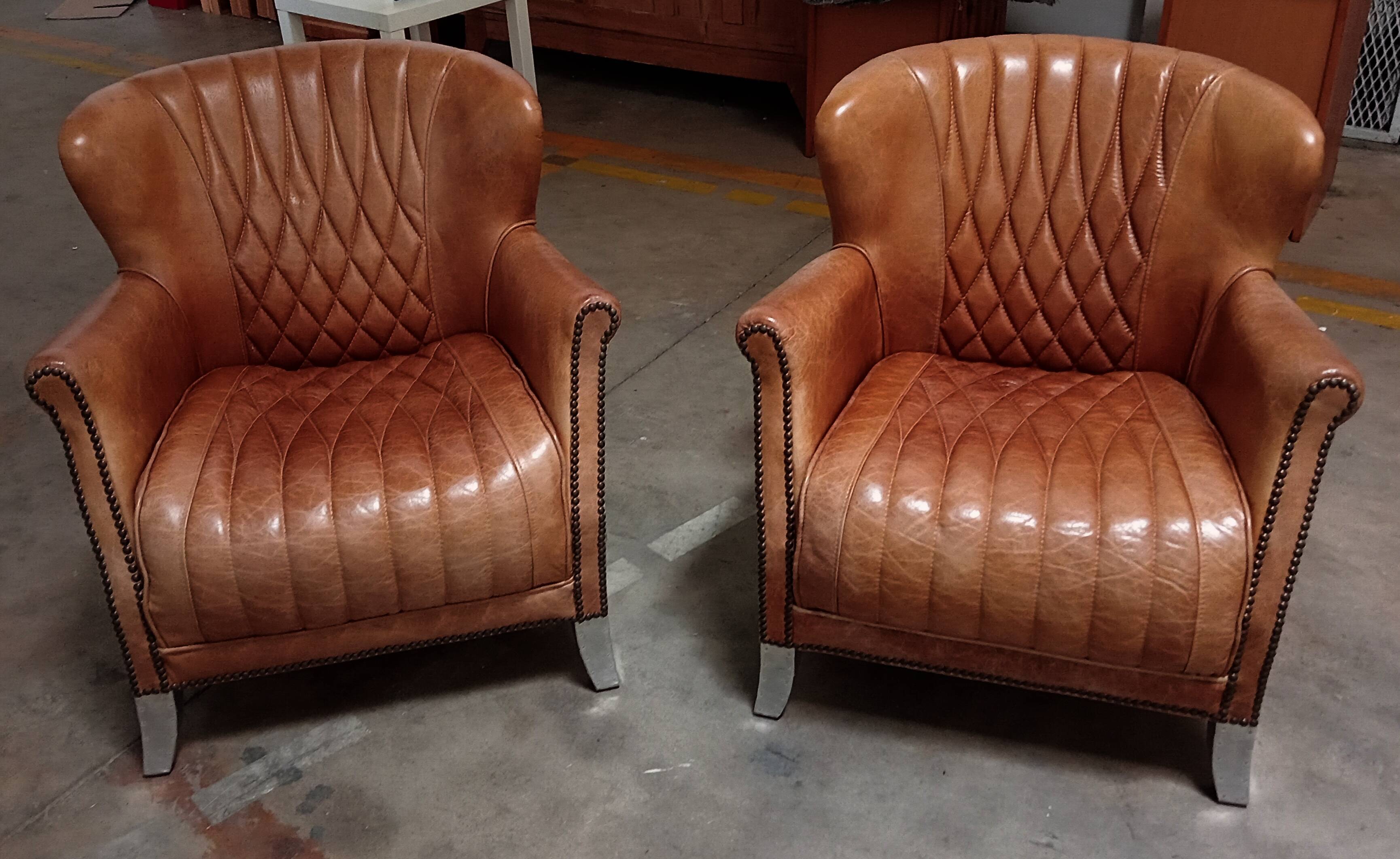 2 aviator armchairs