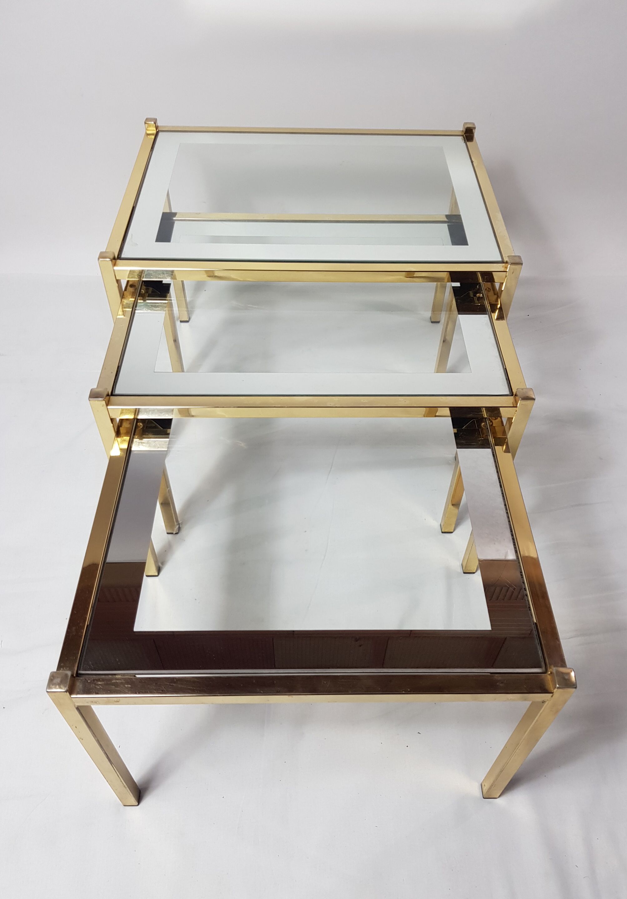 Three trundle tables gilded brass and silver 60s