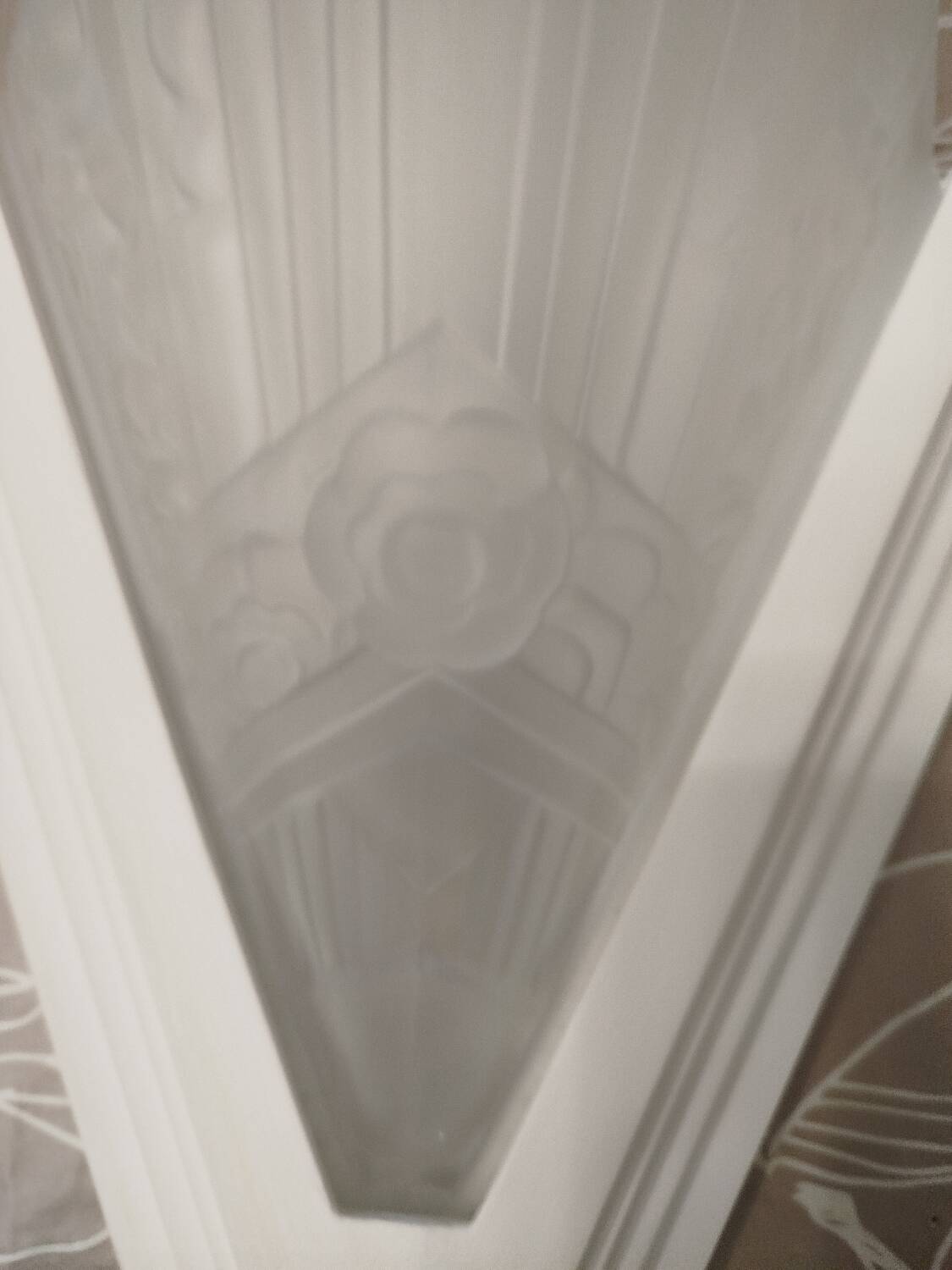 Pair of Art Deco wall sconces in plaster and pressed glass.