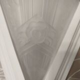 Pair of Art Deco wall sconces in plaster and pressed glass.