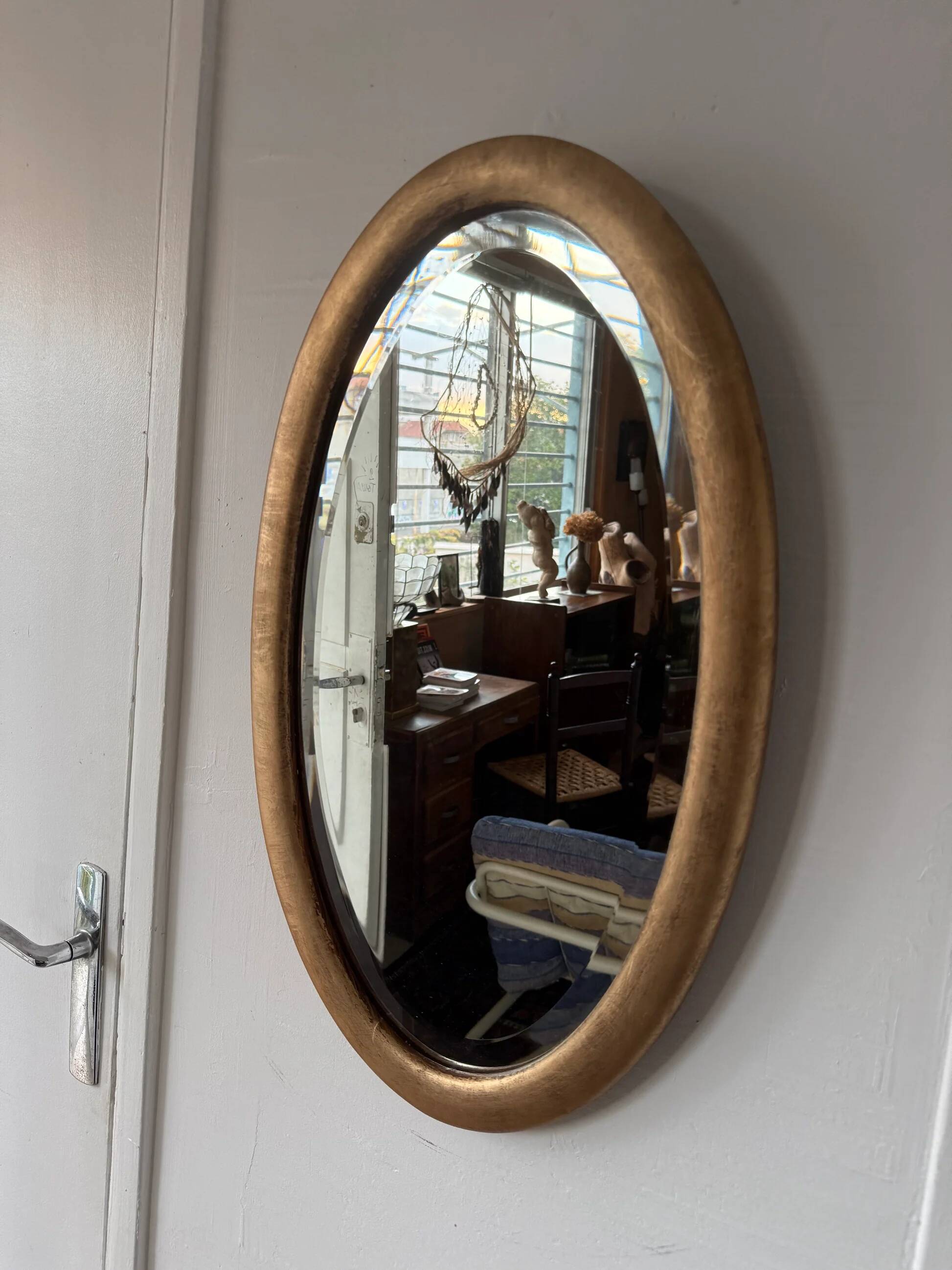 Miroir doré ovale ancien glace biseautée