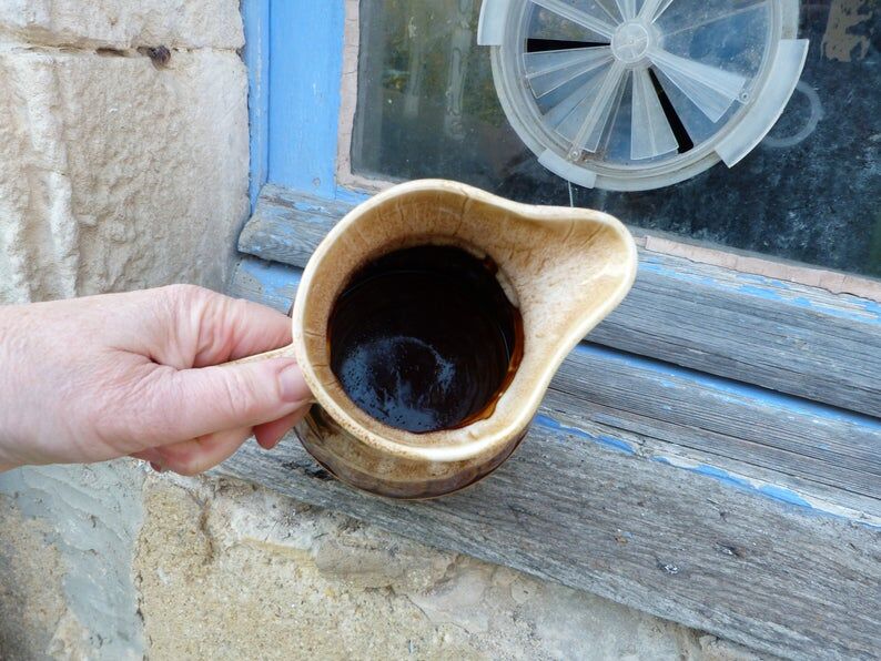 Former wine pitcher in glazed earth style bistrot auberge