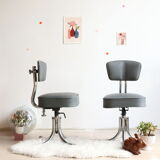 Pair of workshop chairs from the 50s in chrome steel and imitation leather