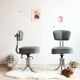 Pair of workshop chairs from the 50s in chrome steel and imitation leather