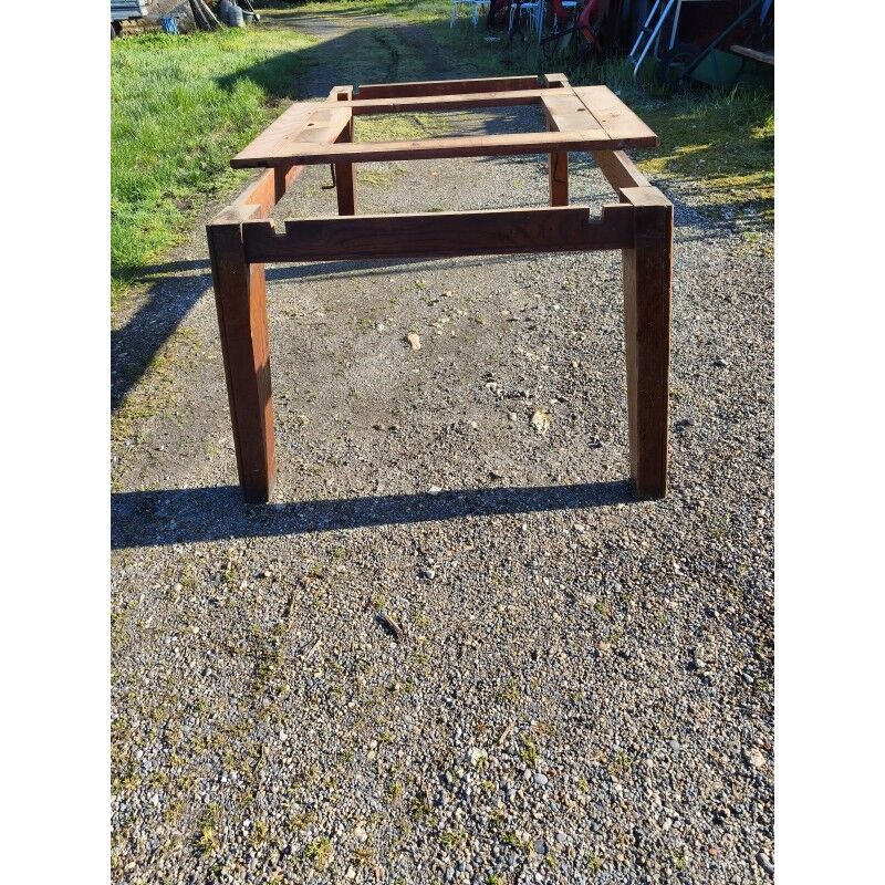 1960s oak dining table with integrated extensions.