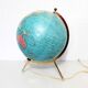 Luminous world map in tripod glass