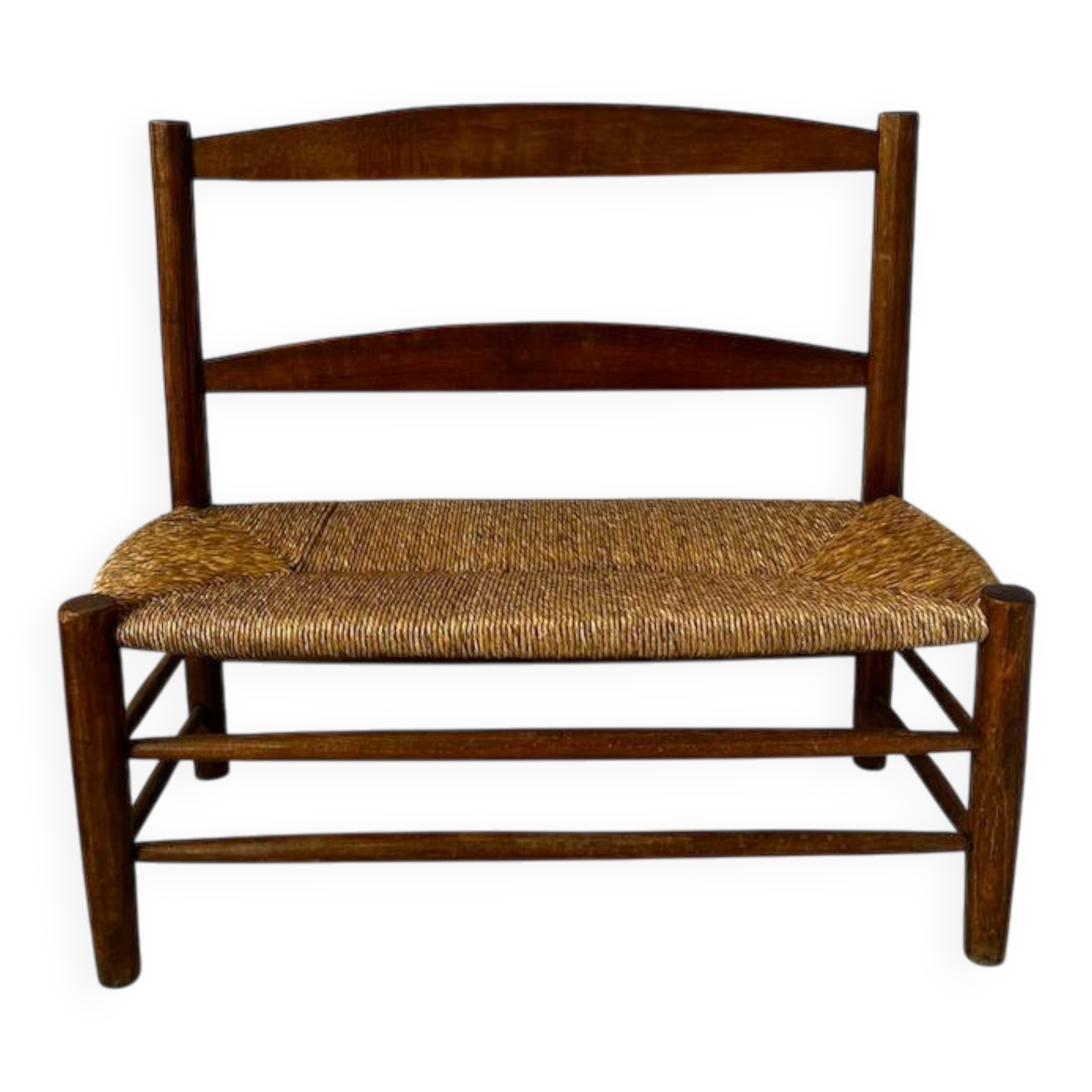 Old wooden and straw bench