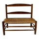Old wooden and straw bench