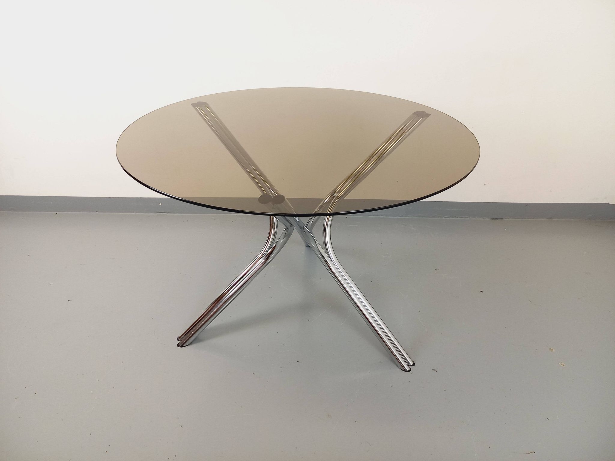 Vintage round dining table in smoked glass and chromed metal, Space Age style, from the 70s