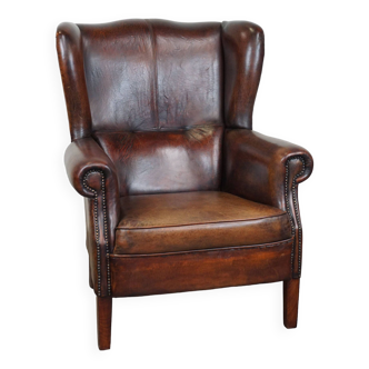 Large Sheepskin Leather Wingback Armchair with a Fixed Seat Cushion and a Stunning Patina