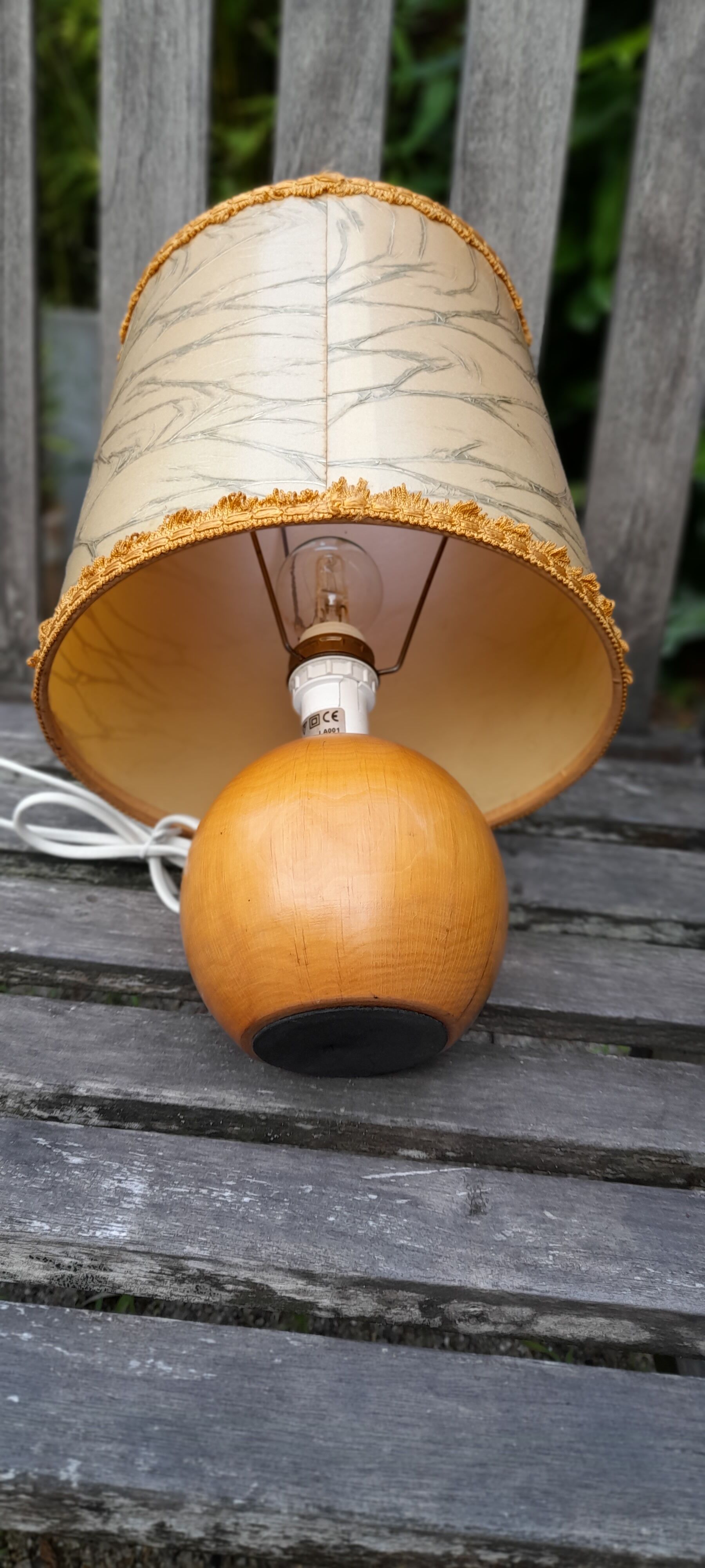 Light wood round foot laying lamp and old lampshade