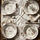 4 flat plates by Bernardaud, Limoges porcelain, floral decoration from the 1920s to 1950s.