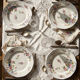 4 flat plates by Bernardaud, Limoges porcelain, floral decoration from the 1920s to 1950s.