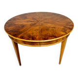 Round walnut Napoleon III extendable table with bronze top in good condition.