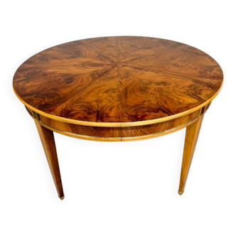 Round walnut Napoleon III extendable table with bronze top in good condition.