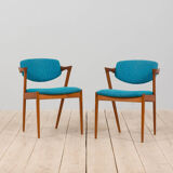 Pair of 42 Kai Kristiansen teak chairs in original blue bouclé upholstery, Denmark, 60s.