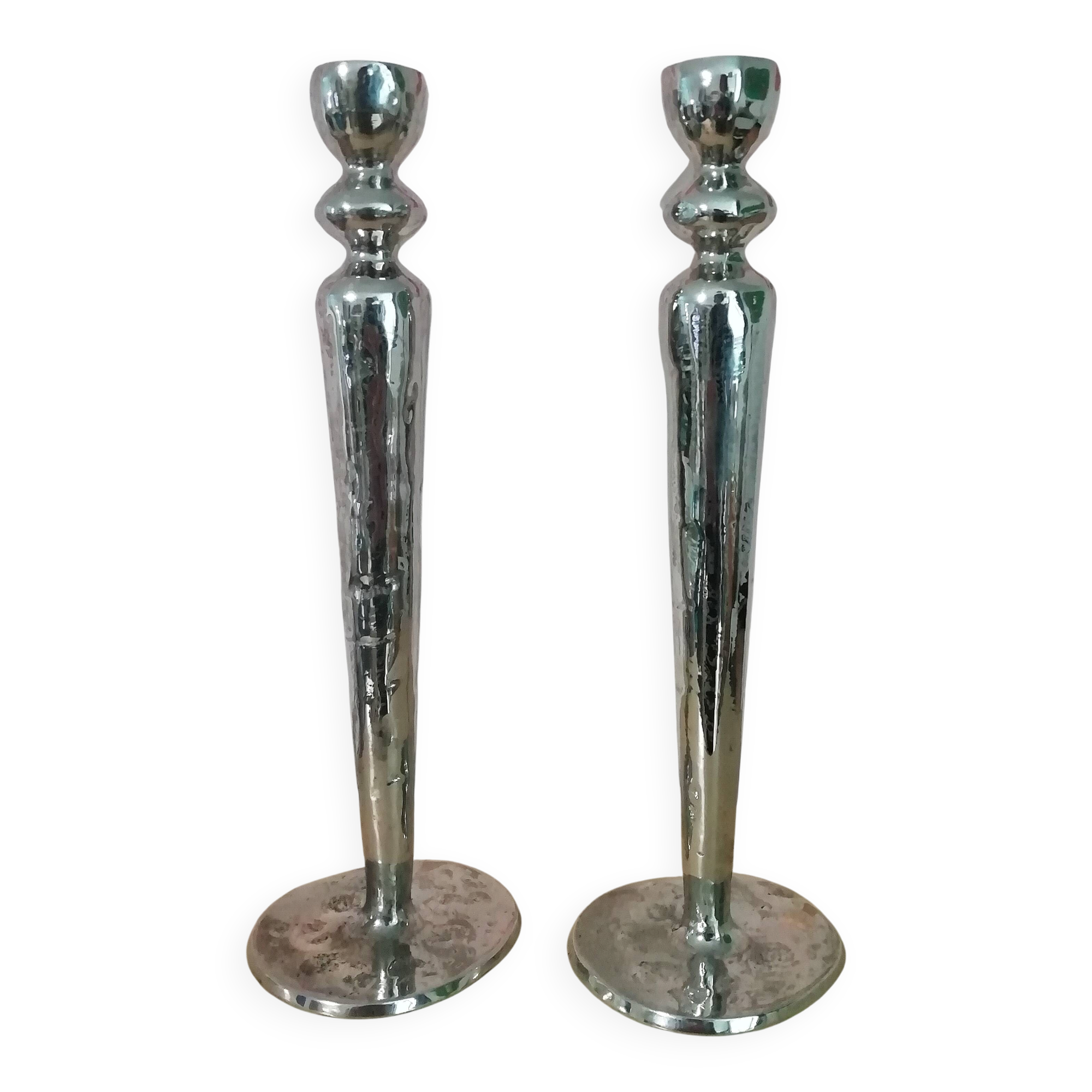 Pair of hammered metal candlesticks