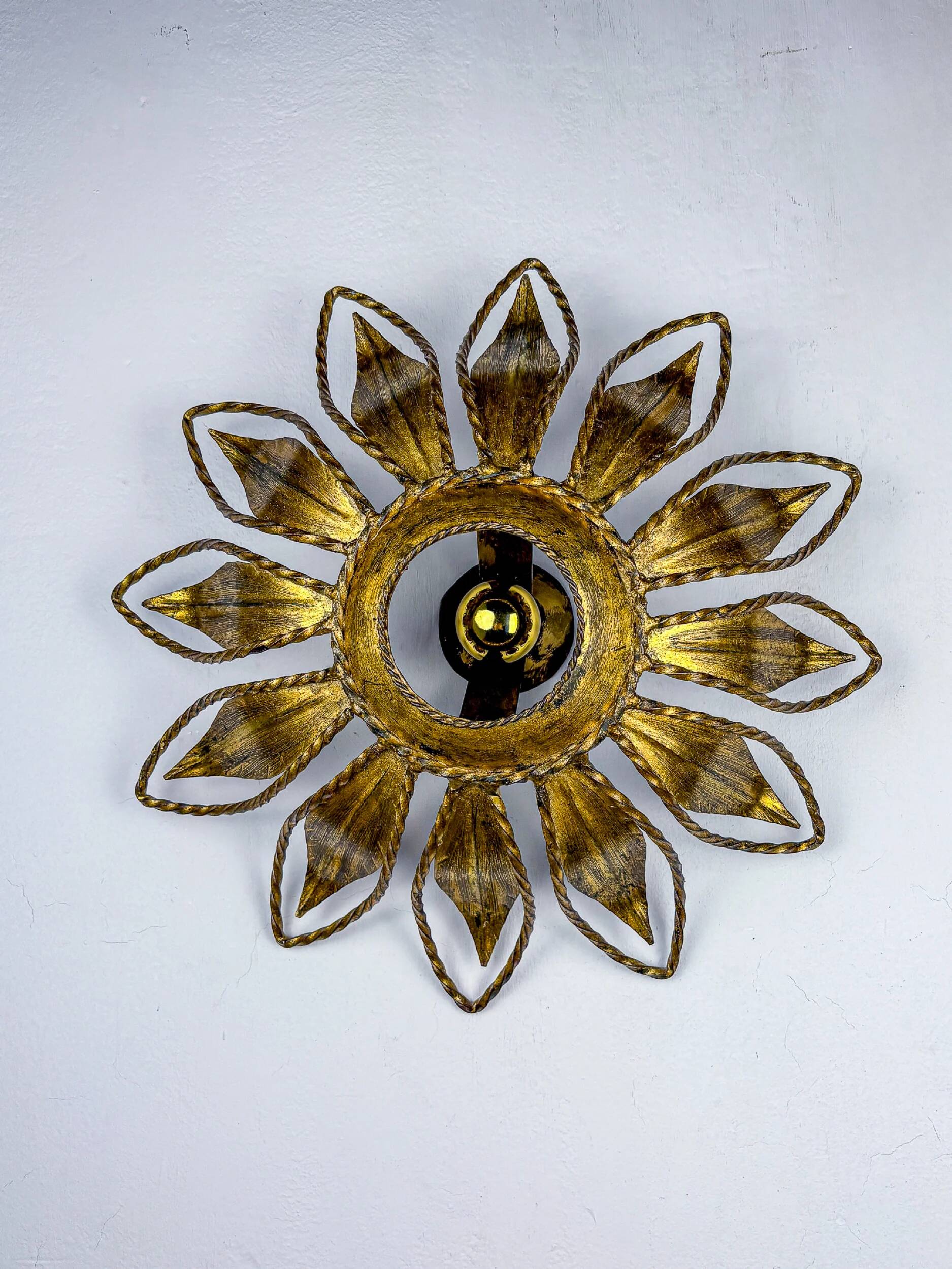 Sunburst ceiling light fixture or sconce, gilt iron & exposed bulb France, 1970s