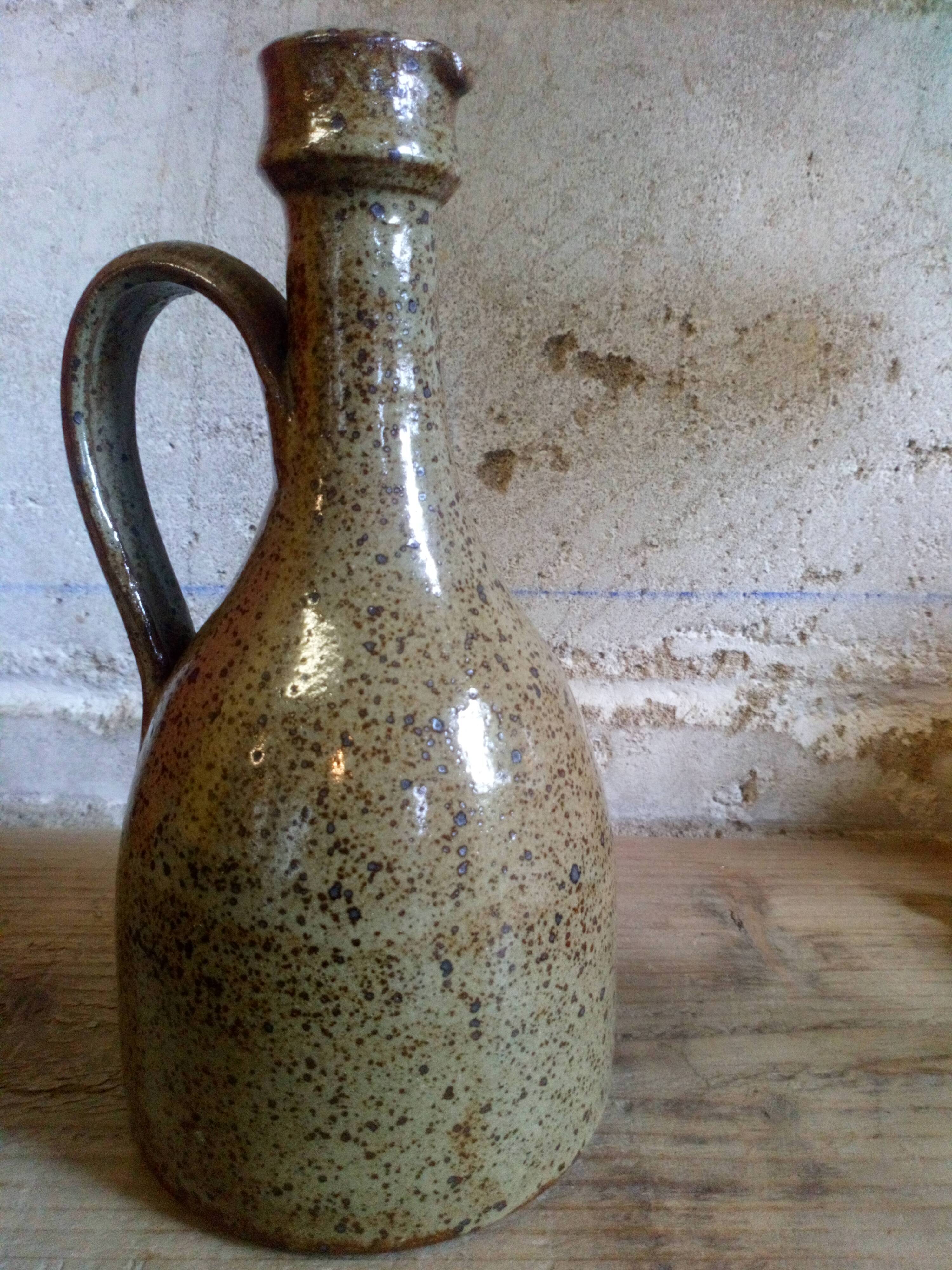 Vintage pottery in sandstone with handles and small beak