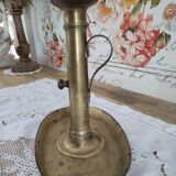 Brass pusher candle holder on oval frame