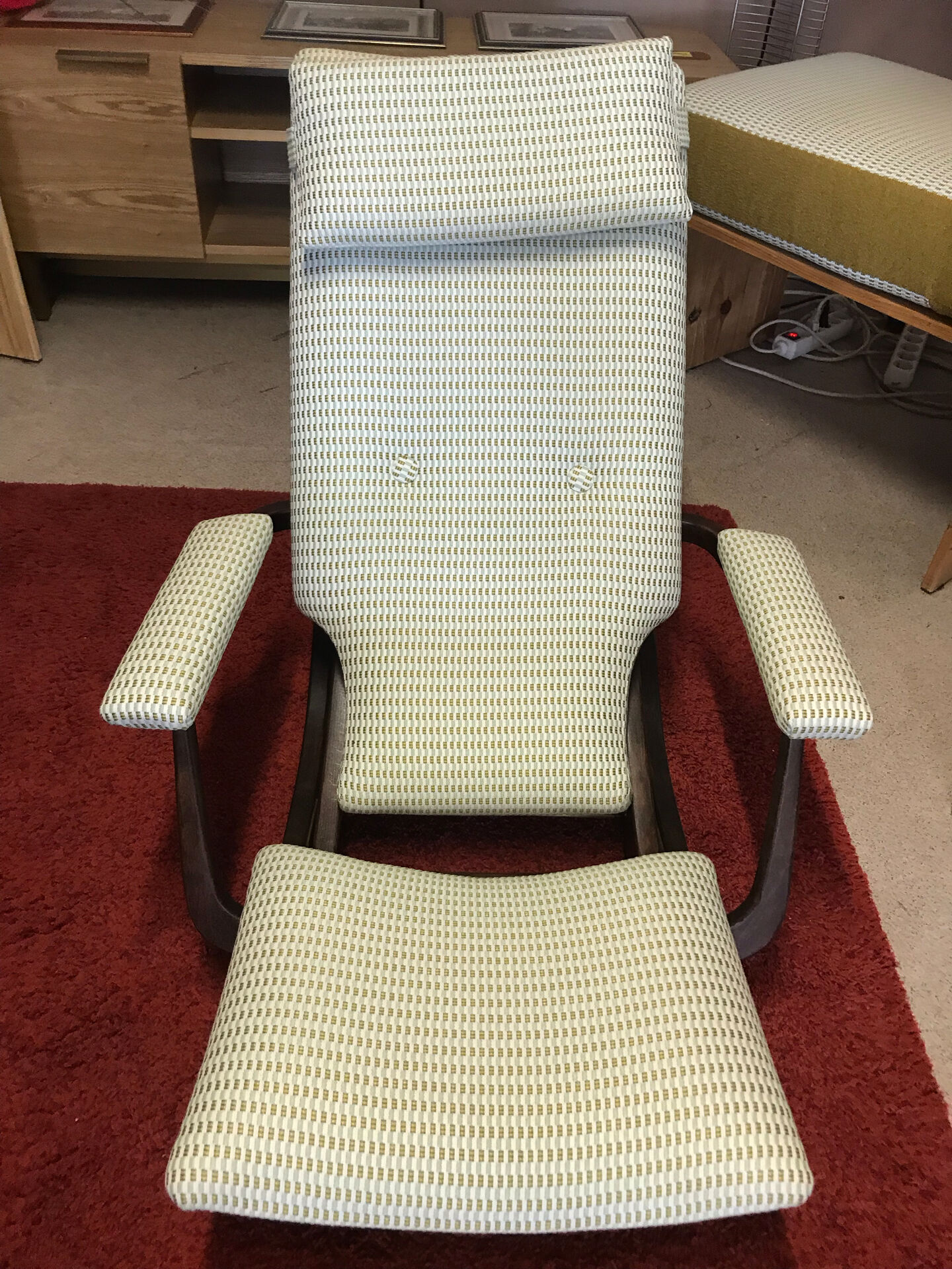 Rocking lounge chair made of fabric suitable for outdoor use.
