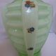 Ancient green opaline crystal vase decorated with small multicolored flowers