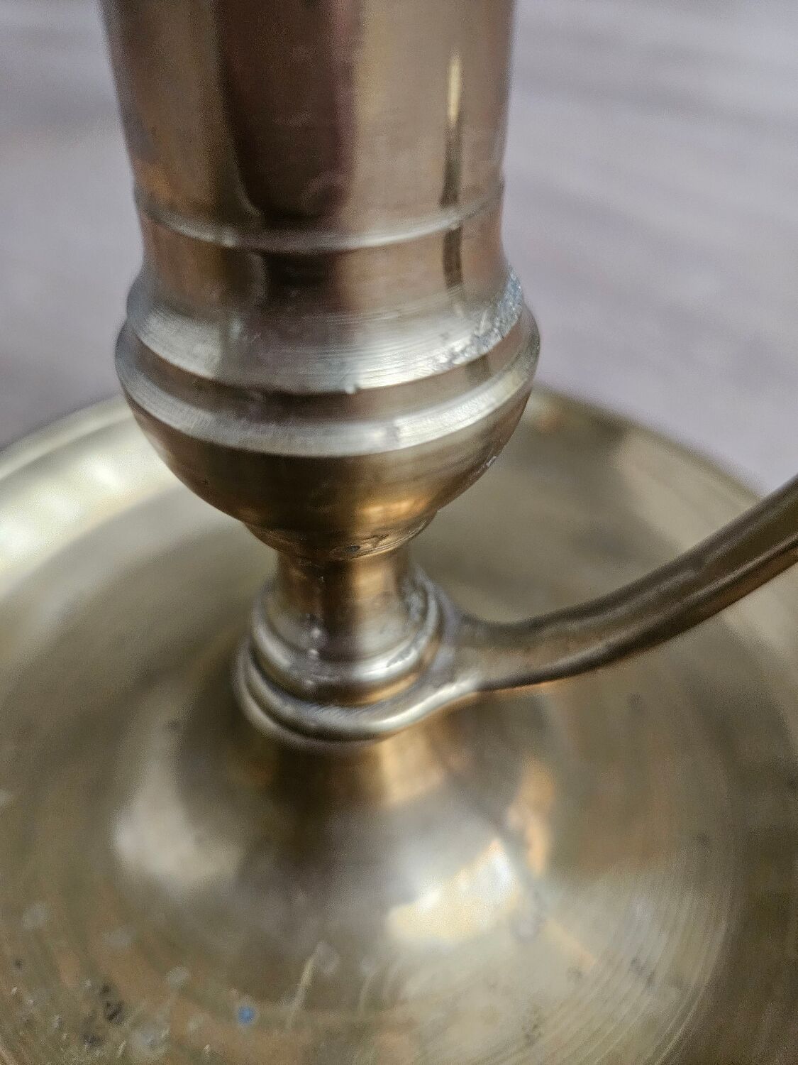 Hand candlestick with brass fitter