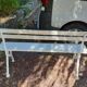 Old garden bench with cast iron feet and wooden planks