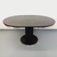 Vintage dining table in melamine with a black wood effect and chrome metal.