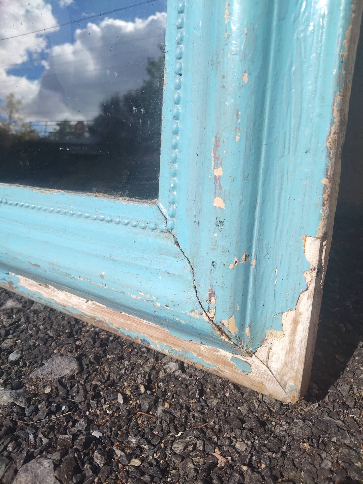 Large Louis-Philippe mirror from the 19th century in wood and stucco with a turquoise blue patina.