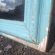 Large Louis-Philippe mirror from the 19th century in wood and stucco with a turquoise blue patina.