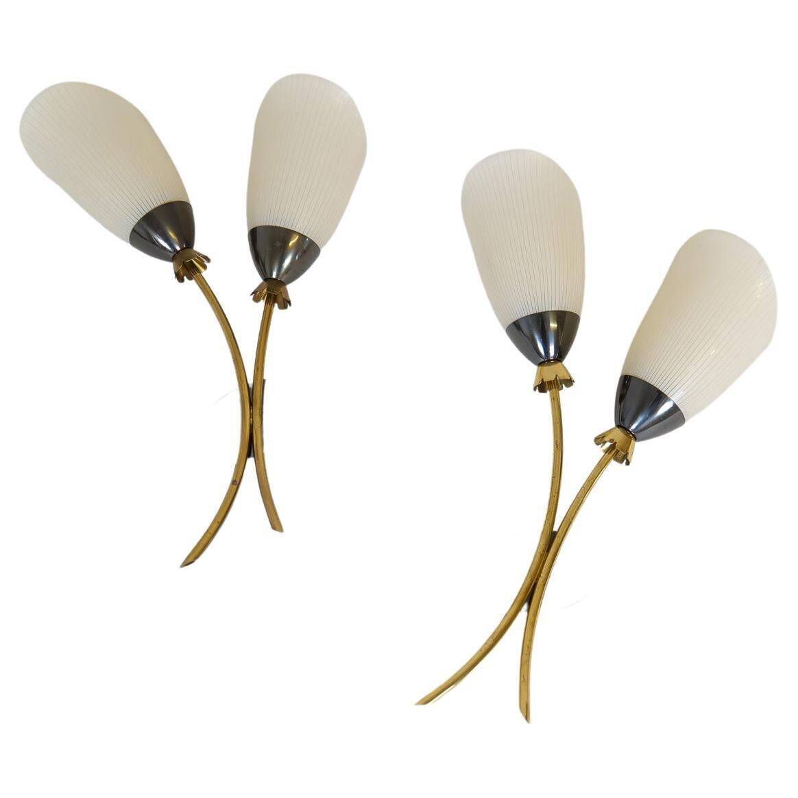 Mid-century pair of wall lamps in brass and opaline attributed to Asea Sweden, 1950s.