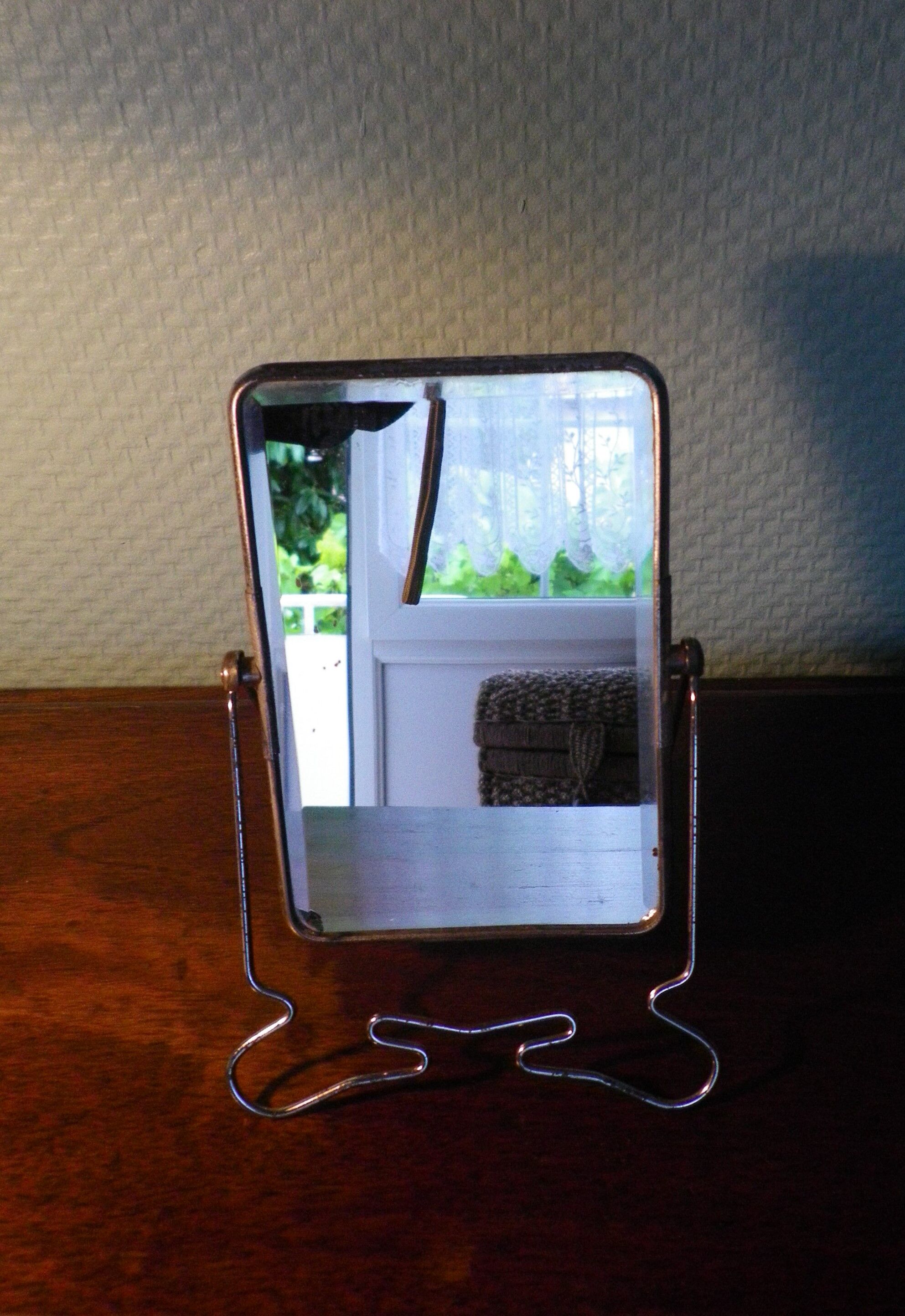 Two-foot barber mirror, suspension mode, beveled, chrome metal - 70s -
