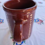 Enamelled clay pitcher