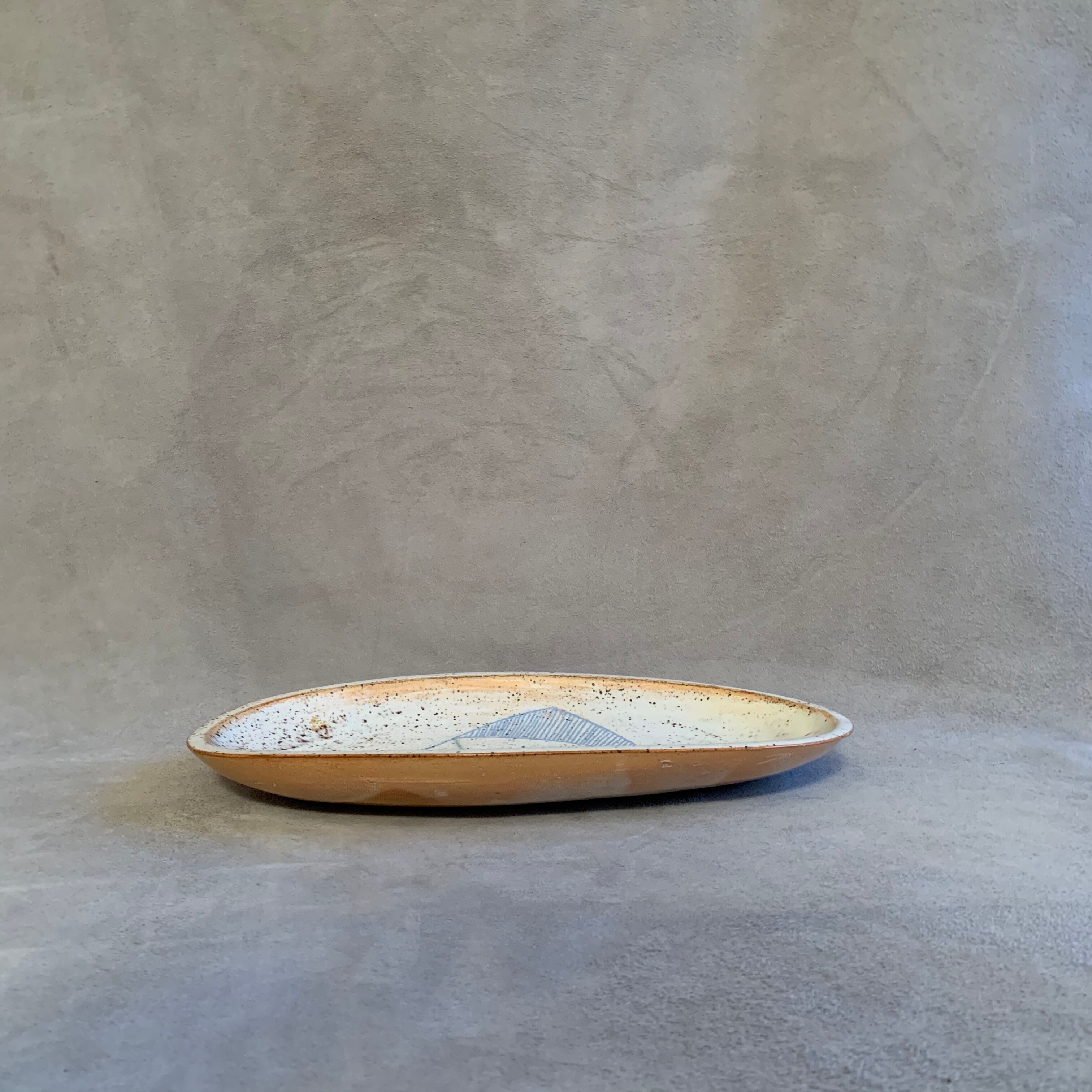 Terracotta /sandstone dish signed with fish drawing